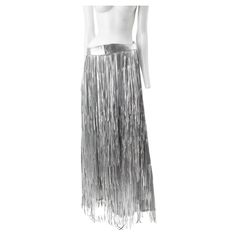 c.1980s Silver Leather Fringe Maxi Skirt, Western; Full length pencil skirt with tiered fringe; Side zipper fastening; Together with silver leather belt; Fully lined; Unlabeled. Fits US size 6 Fringed Long Skirt For Party, Long Party Skirt With Fringe, Fringe Maxi Skirt, Fringe Skirt, Leather Fringe, Leather Belt, Side Zipper, Maxi Skirt, Pencil Skirt