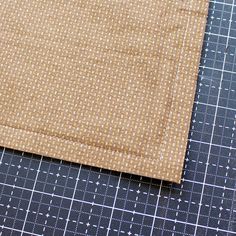 a piece of cloth sitting on top of a cutting board