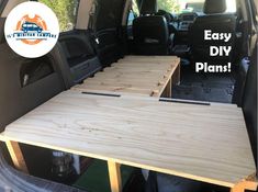 an easy diy plan for the back of a van with wood planks in it