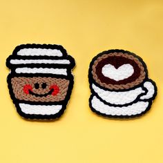 two crocheted coasters depicting coffee and a cup of coffee on a yellow background