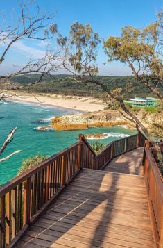 a wooden walkway leading down to the beach