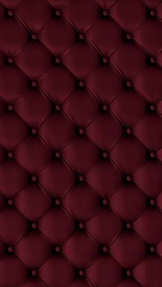 an upholstered red leather background