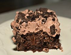 a piece of chocolate cake on a white plate