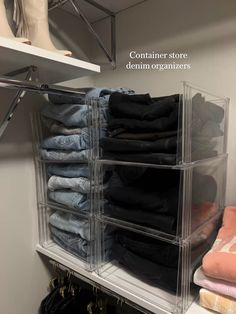 a closet filled with lots of clothes on top of a white shelf next to a pair of shoes