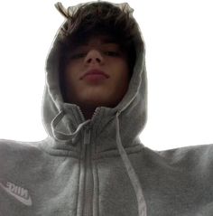 a young man wearing a grey nike hoodie