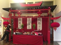 a red and black stage set up for a chinese new year's eve party