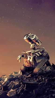 an old robot is sitting on top of a pile of rubble and looking up at the sky