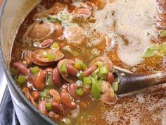 a pot filled with beans and other vegetables