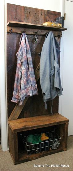 a coat rack with some jackets hanging on it