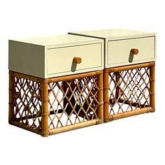 two side tables made out of wicker with handles on each end and one drawer open