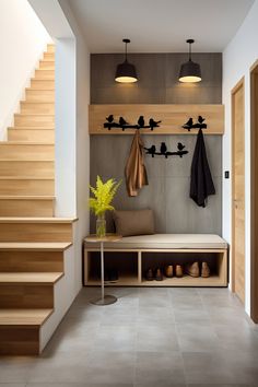 there is a bench and some shoes on the floor in this room with wooden stairs