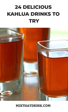 two glasses filled with liquid sitting on top of a table