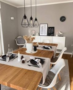 a dining room table is set with place settings