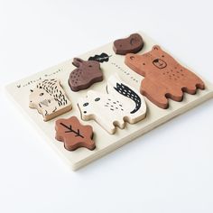 a wooden puzzle with different animals on it