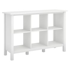 a white book shelf with four shelves