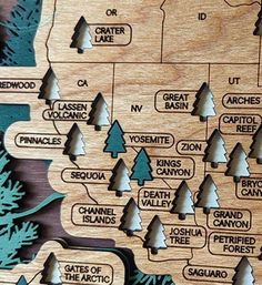 a wooden map with trees and names on it