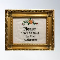 a cross stitch picture frame with a quote on it that says please don't do cake in the bathroom