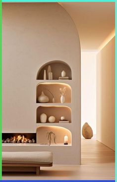 a living room filled with furniture and a fire place next to a wall mounted shelf