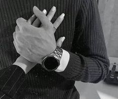 black and white photograph of a man holding his hands together