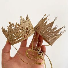 Material:Lace Weight:Around 25 g Size:7.5*6 cm(3*2.4 inches) This handmade gold color mini tiara is made with high-quality thread and then woven to a delicate crown that looks so appealing and unique. This beautiful birthday crown provides two different styles for your choice: the one is flower shape, and the other crown comes with some pieces of fake diamond. Each one is so pretty, and you can find the most suitable one from these two projects. Our mini lace baby crown headband uses a soft mate Gold Party Crown, Gold Tall Crown For Birthday, Whimsical Gold Crown For Party, Baby Crown Headband, Gold Birthday Crown With Tall Shape, Flower Hair Band, Baby Crown, Mini Crown, Lace Crowns