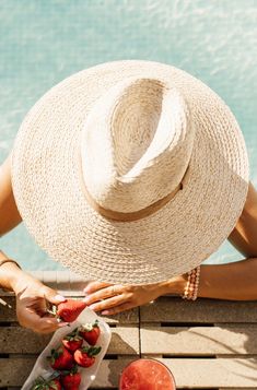 This summer, freshen up your outdoor look with a delightfully woven straw hat, fit with an on-trend flat brim, and topped off with a velvet trim for a hint of sophistication. It's the perfect accessory to bring a fun and fashionable flair to your beach days, pool parties, and picnics. So go ahead, rock the Piña Colada Hat and get ready to make summer memories! Check out when Brittnie paired this gorgeous hat with the Cancun Cabana Dress HERE. MMT8042 Beach Sand And Hat, Fancy Hats Classy Beach, Luxury Summer Party Sun Hat, Summer Party Felt Hat, Fancy Hats Beach, Luxury Summer Beach Cowboy Hat, Luxury Chic Toquilla Straw Hat, Luxury Fitted Mini Hat For Beach, Beach Day Accessories