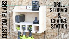 the drill storage and charge station is made from plywood planks with tools attached to it