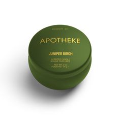 a green container with the words apothee on it sitting on a white surface