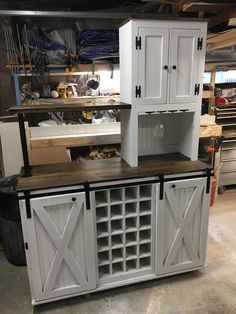 the cabinets are made out of wood and have sliding doors