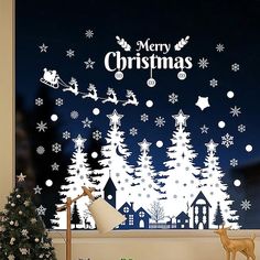 a christmas scene is shown through a window with snowflakes and santa's sleigh