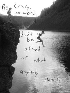 a person jumping off the edge of a cliff into a body of water with words written on it