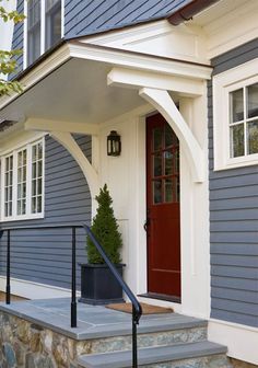 a house with blue siding and white trim