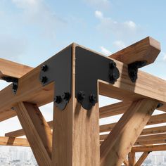 a wooden structure with metal brackets attached to it