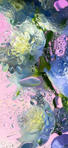 water drops on the surface with pink and blue colors