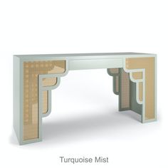 a white desk with an intricate design on it's top and side paneling