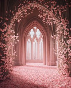 an archway with pink flowers on the floor