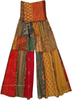 Get ready for a fun day out in these long patchwork wide-legged bohemian pants. The smocked elastic waist gives way to a patchwork construction that then comes down in wide-leg format, albeit in long panels, creating a delectable look. #tlb #SplitSkirtsPants #Patchwork #Tall #bohemianfashion #Handmade #JuniorPetite #TallHippiePants Hippie Wide Leg Patchwork Pants, Hippie Wide-leg Patchwork Pants, Bohemian Wide Leg Bottoms With Patchwork, Summer Wide Leg Patchwork Harem Pants, Bohemian Multicolor Patchwork Bottoms, Multicolor Patchwork Wide Leg Harem Pants, Bohemian Multicolor Patchwork Pants, Bohemian Floral Patchwork Bottoms For Festival, Multicolor Bohemian Wide Leg Harem Pants