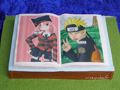 an open book with anime characters on it sitting on top of a green tablecloth