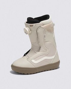 a white snowboard boot with black and grey accents