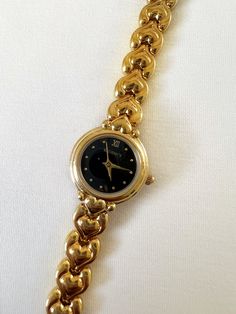 Super cute dainty heart band, black bezel watch. Gold watch stainless steel water resistant. Working with Battery.  Brand: Regency  Condition: Pre-owned, Great Condition  Measurements: Length: 7 inches Face: 0.6 inches x 0.6 inches Gold Watches Women Jewellery, Heart Watches, Dope Jewelry Accessories, Bezel Watch, Accessory Inspo, Heart Watch, Heart Band, Gold Watches, Gold Watches Women