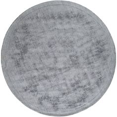 the round rug is made from light gray linen and has an uneven pattern on it