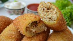 some fried food on a plate with dipping sauce