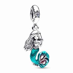 Journey beyond the sea with our Disney The Little Mermaid Ariel Dangle Charm, inspired by the new live-action film adaptation. Celebrate your free spirit and curious heart by adding this sterling silver charm to your collection. Ariel's face and locs are brought to life with engraved details, and her mermaid tail shines with hand-applied teal and cerise enamel. A sparkling aurora borealis clear cubic zirconia rests atop the bail, like the sun reflecting on the ocean waves. Keep Ariel by your sid