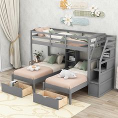 a bunk bed with two sets of beds underneath it and storage drawers on the bottom