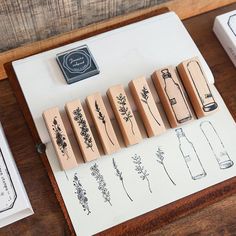 some rubber stamps sitting on top of a wooden table