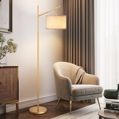 a living room with a chair, lamp and books on the floor in front of a window