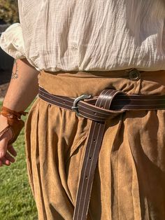 A simple Viking belt with a decorative buckle. Perfect for casual wear, but tough enough for any sea voyage or coastal raids. Belt is left long for tied off style. Made out of 7-8 oz leather. ONE SIZE FITS MOST (28-50") Viking Belt, Adult Costumes, Halloween Shopping, Vikings, Shop House, Favorite Outfit, Casual Wear, Gender Neutral, Bathing Beauties