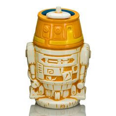 an orange and white coffee cup with a robot design on it