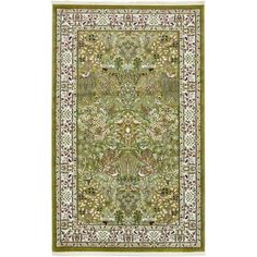 a green rug with an ornate design on the bottom and sides, in various colors