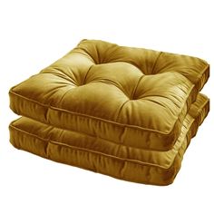 a set of two square cushions on top of each other in gold velvet fabric, with pleated edges