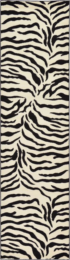 an animal print rug with black and white stripes